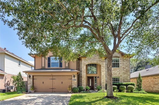 view of front of property with a front lawn and a garage