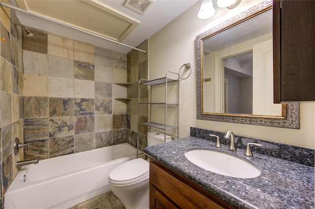 full bathroom with vanity, toilet, and tiled shower / bath