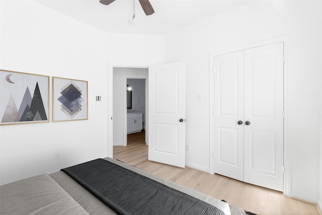 bedroom featuring ceiling fan, a closet, and wood-type flooring