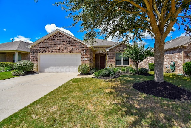 ranch-style house featuring a garage and a front lawn