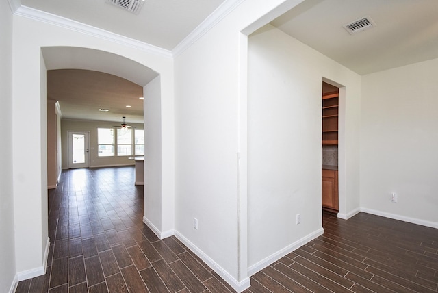 hallway featuring crown molding