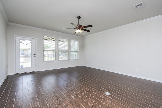 empty room featuring ceiling fan, crown molding, and dark hardwood / wood-style floors