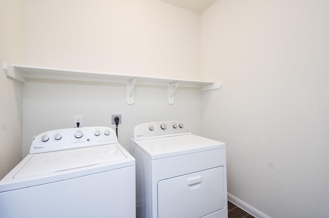 laundry room with dark hardwood / wood-style flooring and independent washer and dryer