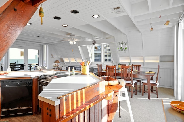 kitchen with lofted ceiling, a water view, sink, ceiling fan, and black dishwasher