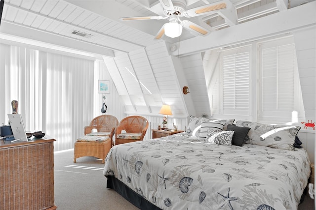 carpeted bedroom with ceiling fan, wood ceiling, and vaulted ceiling