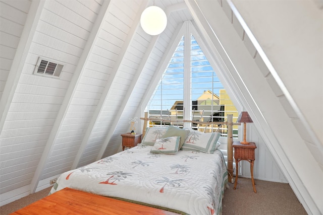 carpeted bedroom with lofted ceiling