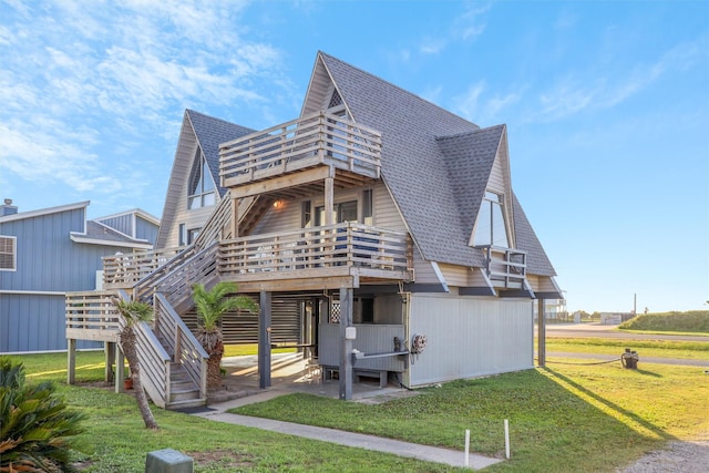 rear view of house featuring a lawn