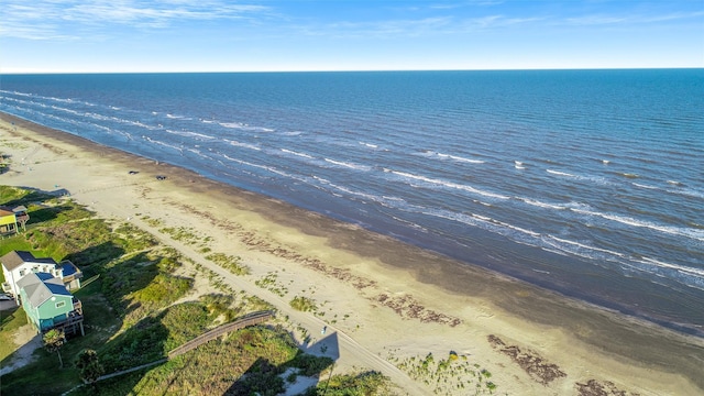 bird's eye view featuring a view of the beach and a water view