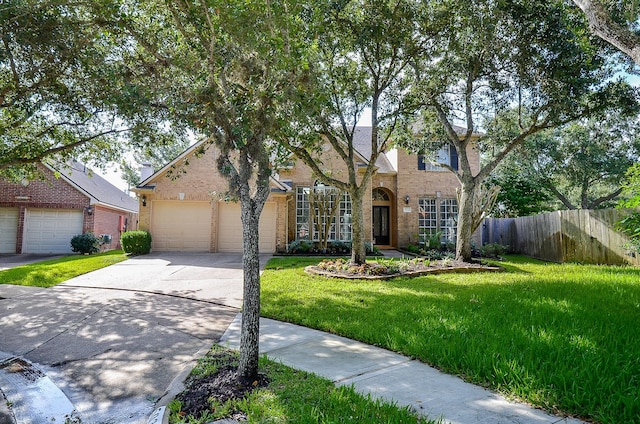 view of front of home with a garage and a front yard