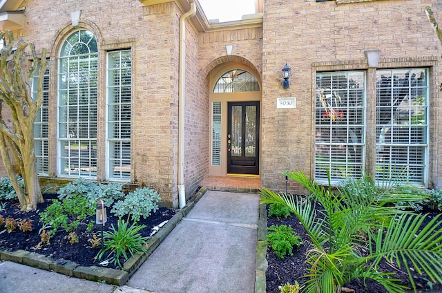 view of exterior entry featuring french doors