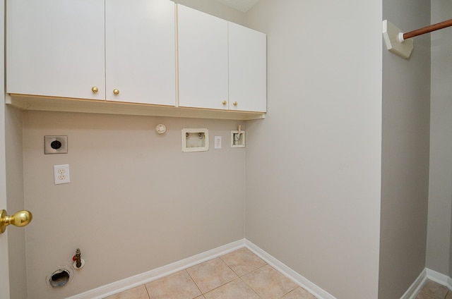 laundry room featuring cabinets, hookup for a gas dryer, hookup for a washing machine, light tile patterned floors, and hookup for an electric dryer