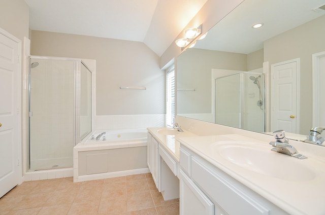 bathroom with tile patterned floors, vanity, lofted ceiling, and shower with separate bathtub