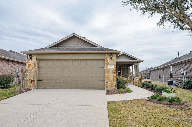 view of front of house with central AC, a front lawn, and a garage