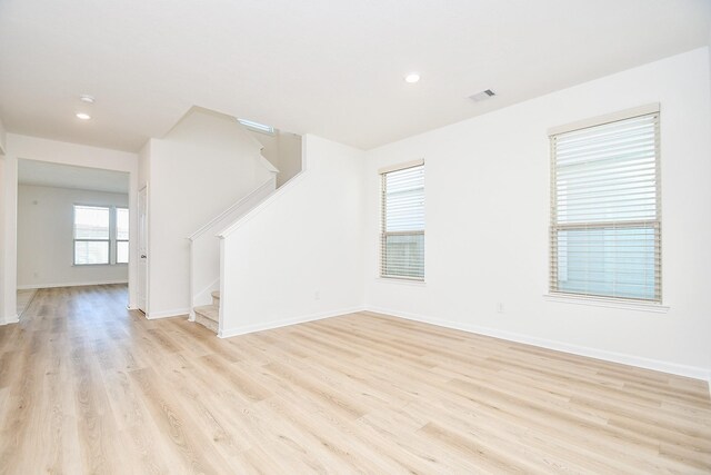 unfurnished living room with light hardwood / wood-style flooring