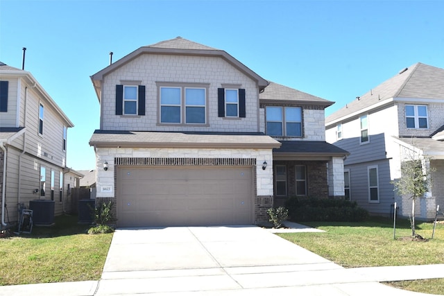 view of front of home with central air condition unit, a front lawn, and a garage