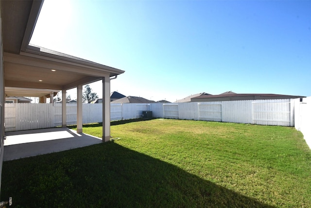 view of yard featuring a patio area and a fenced backyard