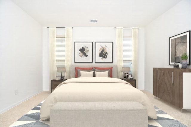 bedroom featuring light colored carpet, visible vents, and multiple windows