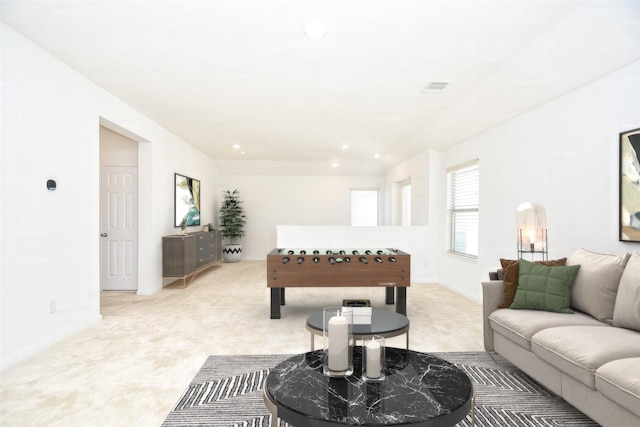 living room with recessed lighting, visible vents, and baseboards