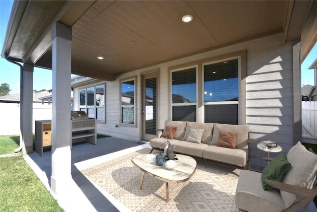 view of patio featuring an outdoor hangout area and fence