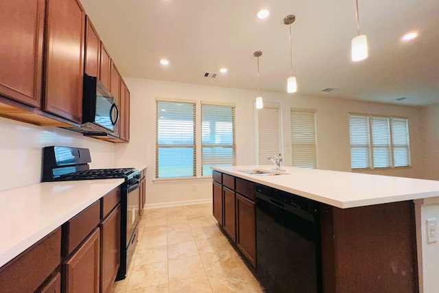 kitchen featuring a sink, visible vents, light countertops, black appliances, and pendant lighting