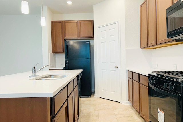 kitchen with brown cabinets, light countertops, hanging light fixtures, a sink, and black appliances