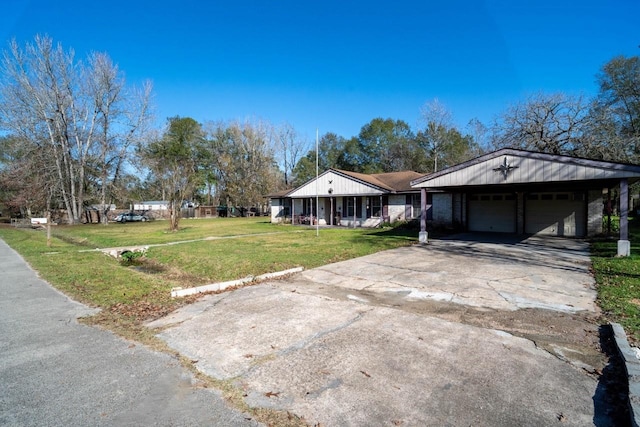 single story home featuring a front yard, a carport, and covered porch