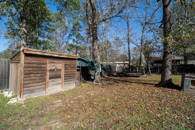 view of yard with a storage unit