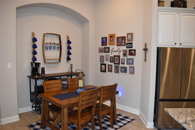 dining space featuring light hardwood / wood-style floors