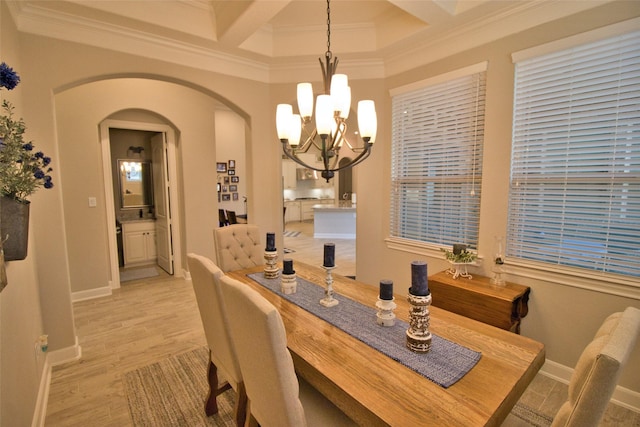 dining space featuring beamed ceiling, a chandelier, crown molding, and coffered ceiling