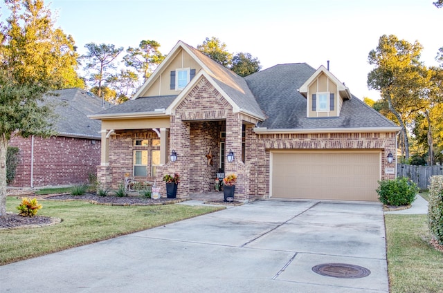 view of front of house with a front yard and a garage