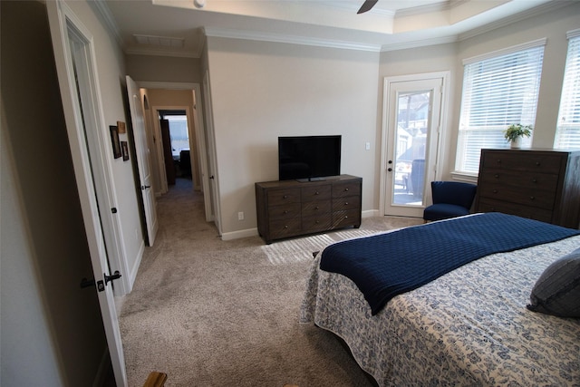 bedroom featuring light carpet, a tray ceiling, crown molding, ceiling fan, and access to exterior