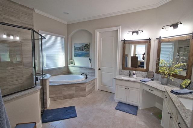 bathroom featuring tile patterned flooring, vanity, crown molding, and plenty of natural light