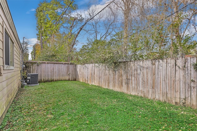 view of yard with central AC