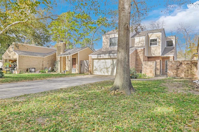 view of front facade featuring a garage and a front lawn