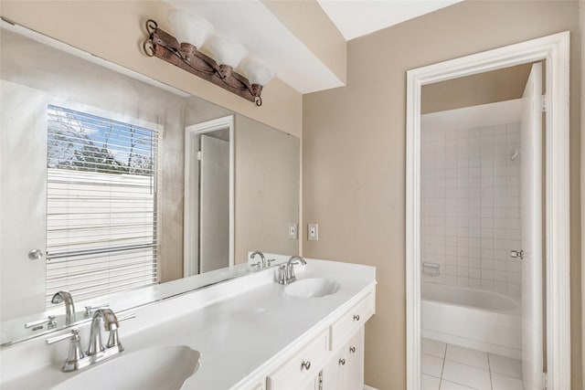 bathroom with vanity, tile patterned floors, and tiled shower / bath