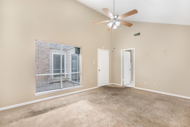 carpeted empty room featuring high vaulted ceiling and ceiling fan