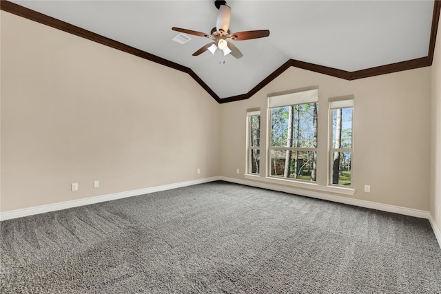 spare room with carpet flooring, vaulted ceiling, ceiling fan, and crown molding