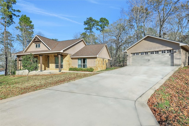 ranch-style house with a garage and covered porch