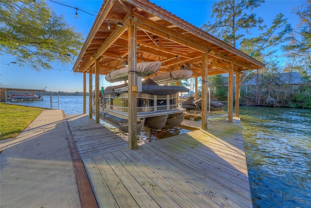 dock area with a water view