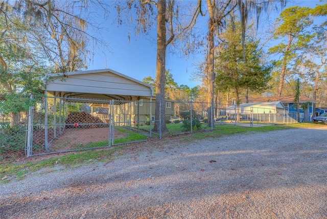 exterior space with a carport