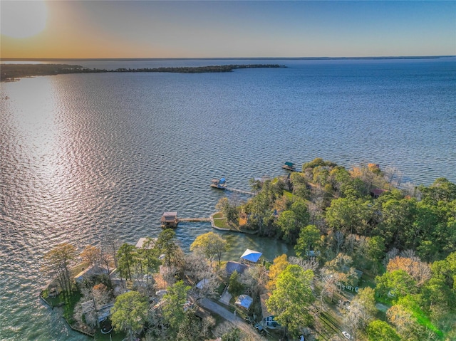 aerial view at dusk with a water view