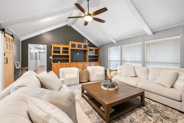 living room with ceiling fan, lofted ceiling with beams, and a barn door