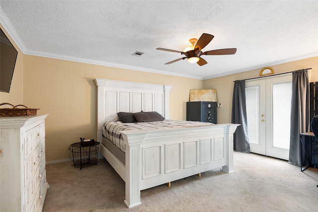 bedroom with crown molding, light colored carpet, a textured ceiling, and ceiling fan