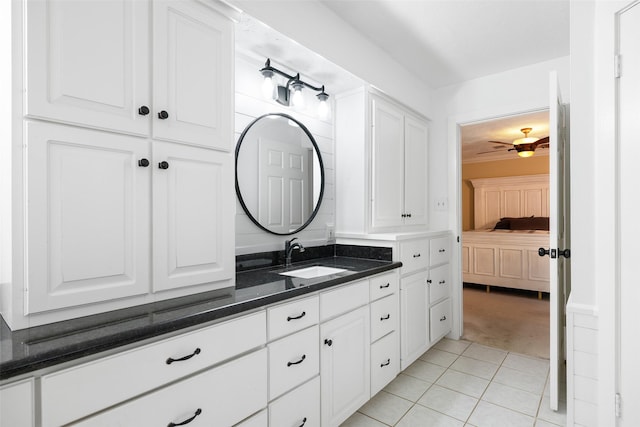 bathroom with ceiling fan, tile patterned floors, and vanity