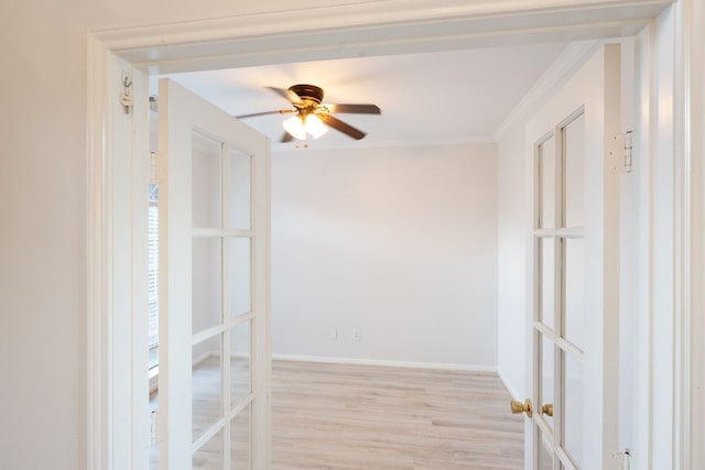 interior space featuring ceiling fan, french doors, light hardwood / wood-style flooring, and ornamental molding