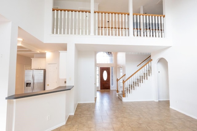 foyer entrance featuring a high ceiling