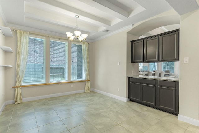 unfurnished dining area with ornamental molding, a wealth of natural light, and a chandelier