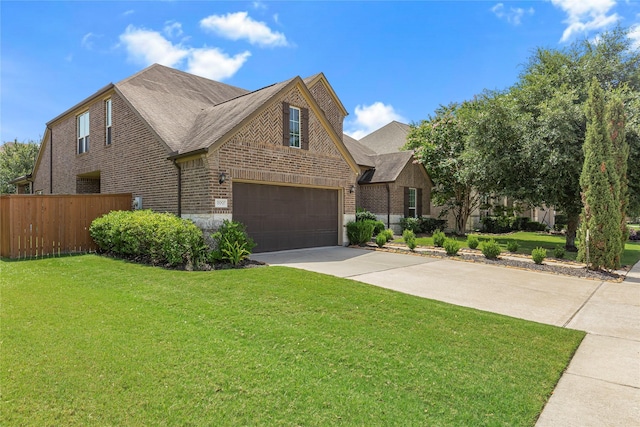 view of front facade with a garage and a front yard