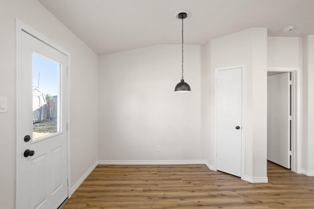 unfurnished dining area featuring hardwood / wood-style flooring