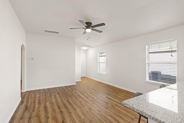 interior space with hardwood / wood-style flooring and ceiling fan